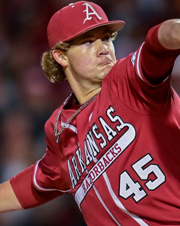 Razorbacks relief pitcher Gage Wood throws a pitch will closing last three innings in win over Tennessee.